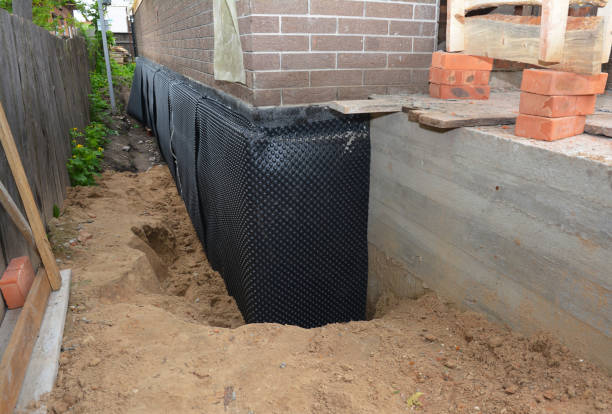 Happy homeowners after waterproofing job in Franklin Square